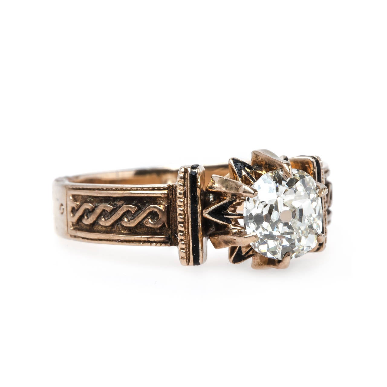 Marrakech is an intriguing authentic Early Victorian era (circa 1840) 14k rose gold ring centering a six-prong set 0.91ct EGL certified Old Mine Cut diamond graded K color and SI1 clarity. The stunning and unique antique ring is further decorated