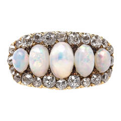 Whimsical Victorian Era Opal Ring with Old Mine Cut Diamond Halo