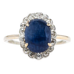 Alluring Victorian Era Cabochon Sapphire Ring with Old Mine Cut Diamond Halo