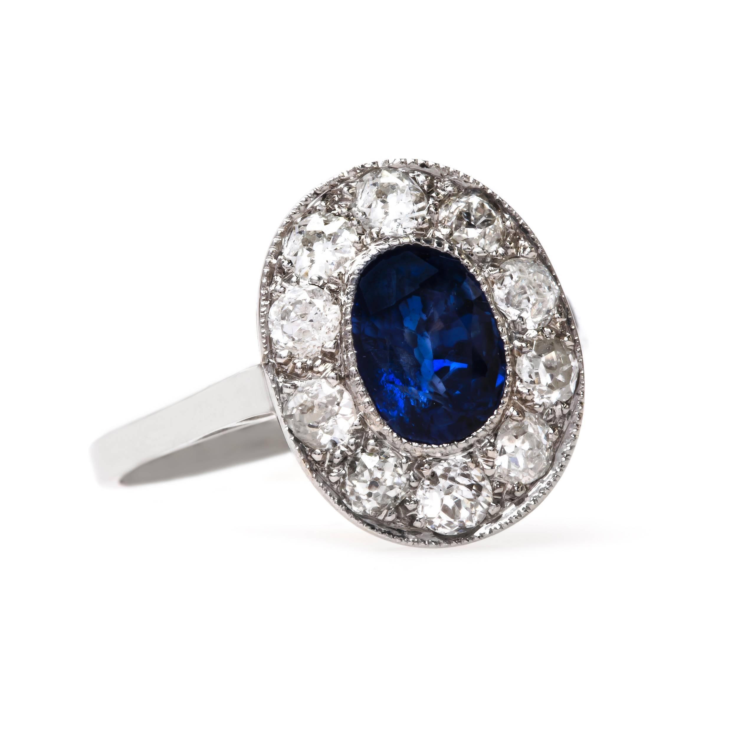 Milan is an alluring and authentic Art Deco (circa 1930) 18k and 14k white gold ring centering a brightly saturated Oval Cut sapphire. It is likely that Milan started its life as an earring! This bezel set beauty centers a beautiful sapphire gauged