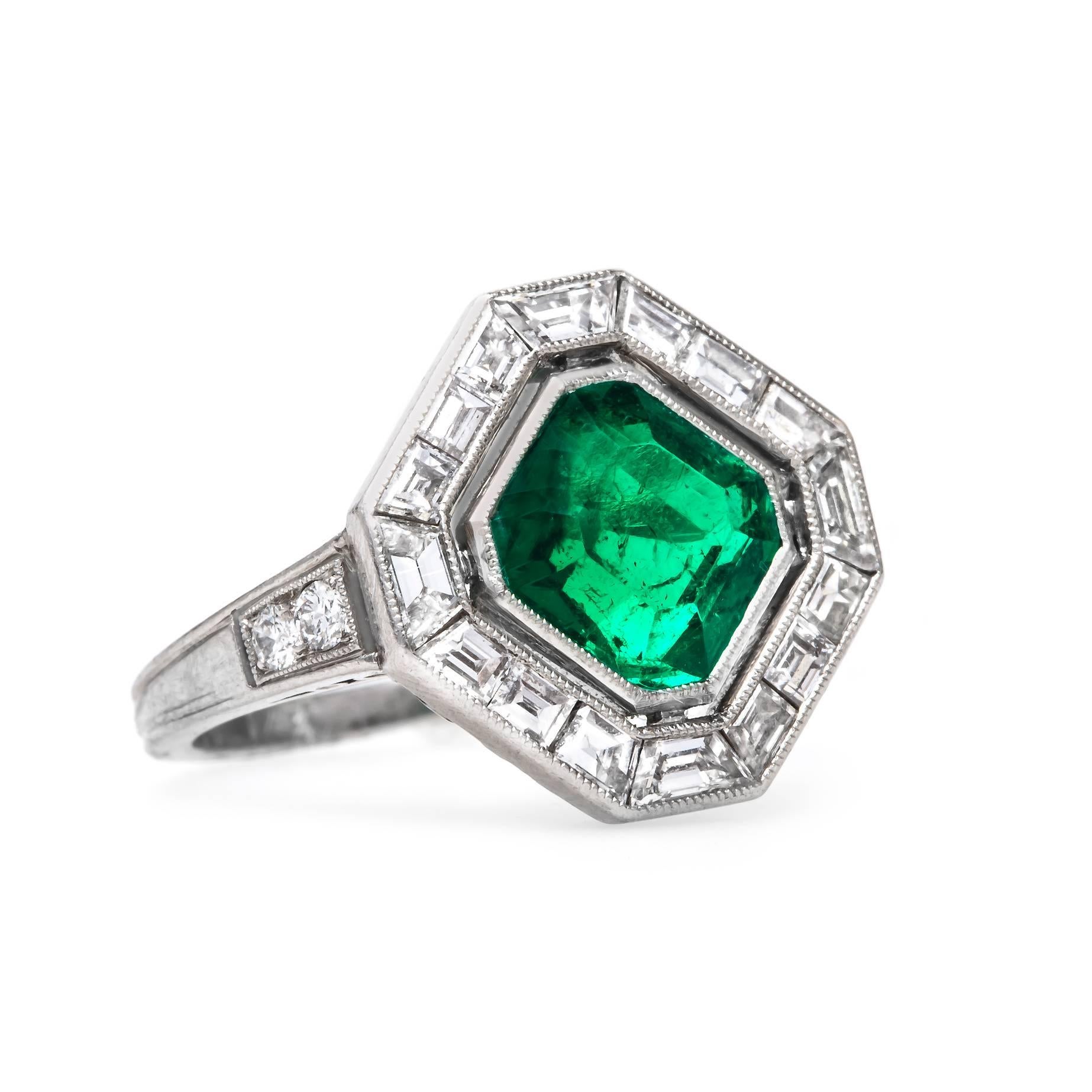 Penngrove is an unbelievable authentic Art Deco (circa 1923) platinum ring centering a Square Step Cut natural emerald gauged at 7.25mm x 7.25mm x 4.40mm totaling approximately 1.70ct in weight and accompanied by a Guild Laboratories Certificate