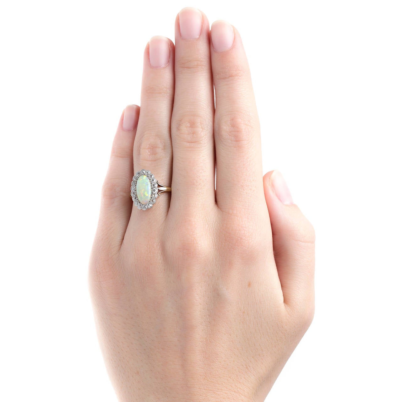 Captivating Victorian Era Cabochon Opal Engagement Ring with Diamond Halo In Excellent Condition In Los Angeles, CA