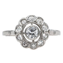 Delightful Edwardian Era Halo Engagement Ring with Scalloped Frame