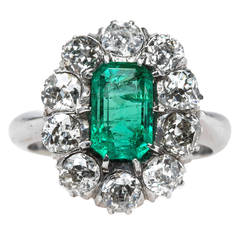 Columbian Emerald Engagement Ring with Sparkling Old Mine Cut Diamond Halo