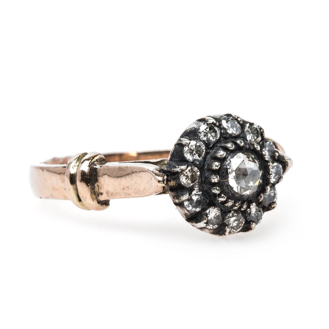 Bairnsdale is a unique yet timeless ring that draws its inspiration straight from the Victorian era. The silver topped 14k rose gold ring centers a single Rose Cut diamond surrounded by a glittering halo of twelve Round Brilliant Cut diamonds