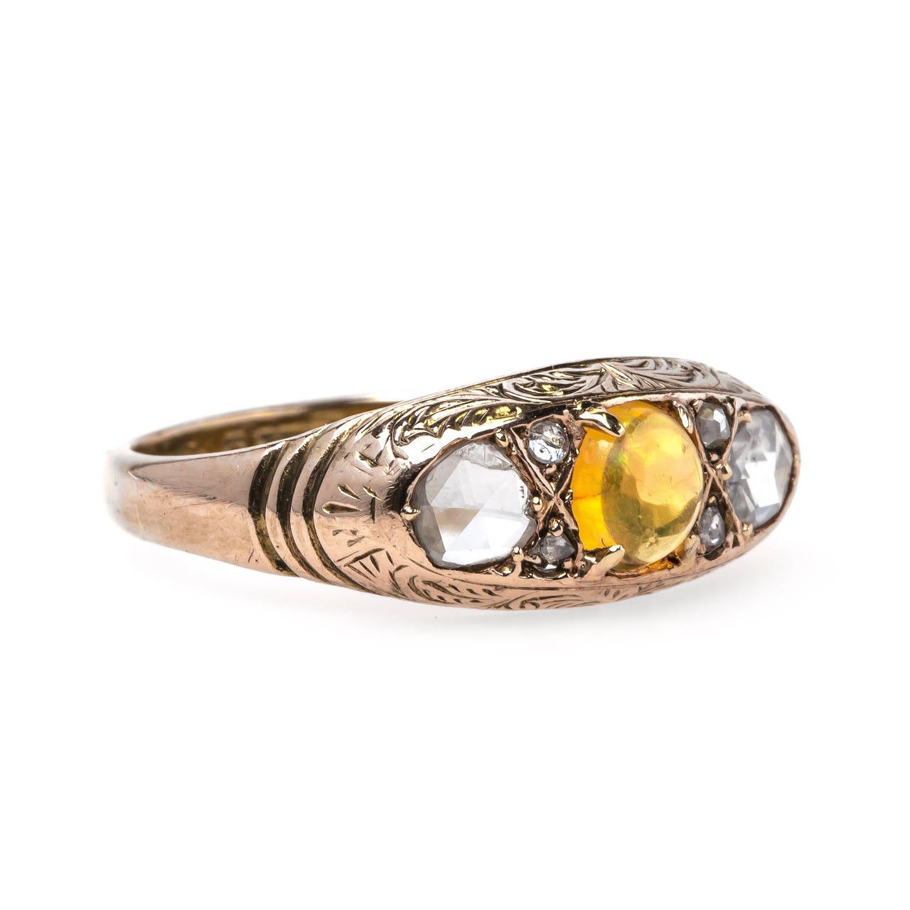 Louisville is a unique and delicate Victorian era (circa 1885) 9k rose gold ring centering a round cabochon bright orange fire opal gauged at 4.25mm in diameter and flanked on either side by six sparkling Rose Cut diamonds totaling approximately