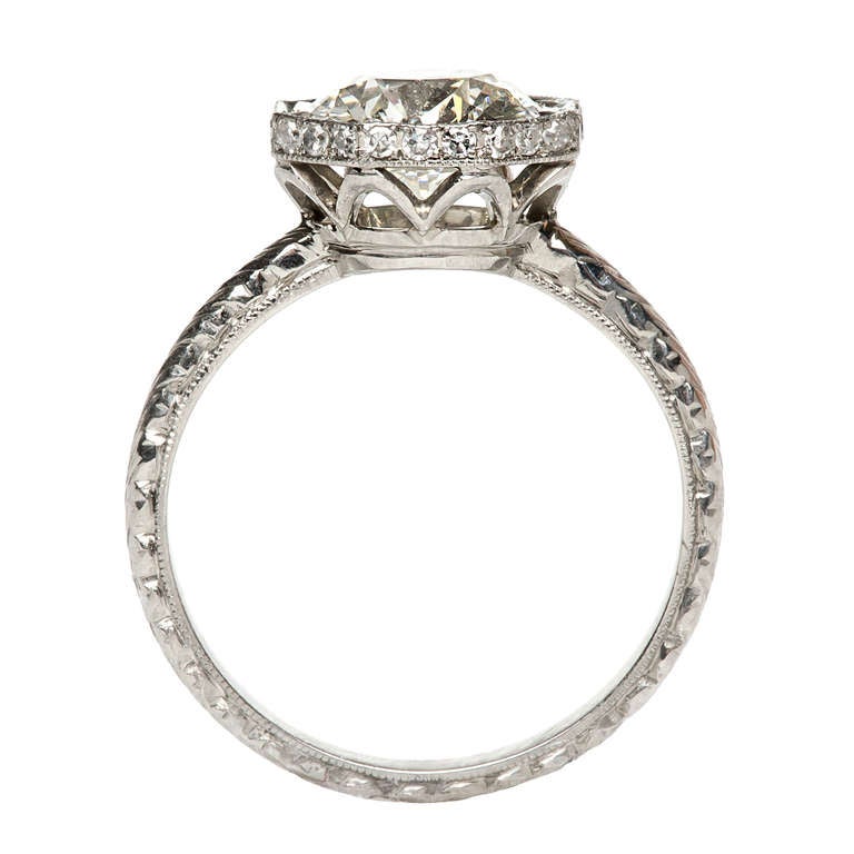Jolie is a wonderful Trumpet & Horn engagement ring. This new beauty is made from platinum and features an incredible EGL certified 1.92ct Old European Cut diamond, graded J color and VS1 clarity. This fabulous solitaire diamond engagement ring
