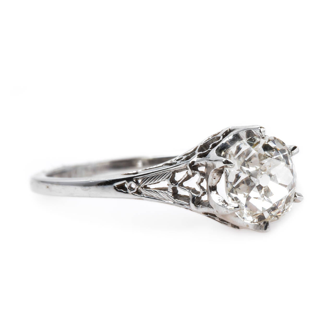 Clydebank is a romantic authentic Edwardian era (circa 1920)18k white gold ring centering a six-prong 0.95ct EGL certified Old Mine Cut diamond graded J color and SI1 clarity. This timeless solitaire engagement ring is finished with beautiful open