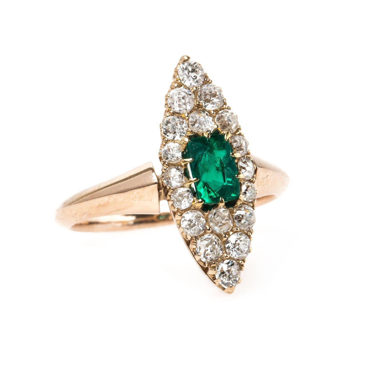 Holly Hill is a striking authentic Victorian era (circa 1890) navette style ring made from 14k rose gold centering a single Rectangular Cushion Cut emerald, ten-prong set, accompanied with a Guild Laboratories certificate stating the emerald is
