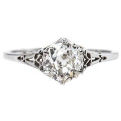 Romantic Edwardian Solitaire Engagement Ring with Heart-Shaped Metalwork