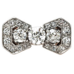 Retro Diamond Platinum Bow Motif Engagement Ring