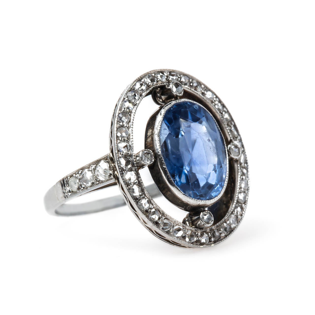 Pacifica is an extraordinary authentic Late Art Deco (circa 1935) 14k white gold ring centering a single bezel set Oval Cut sapphire gauged at 4.50cts accompanied by a GIA certificate stating the Sri Lankan sapphire is unheated. This one-of-a-kind