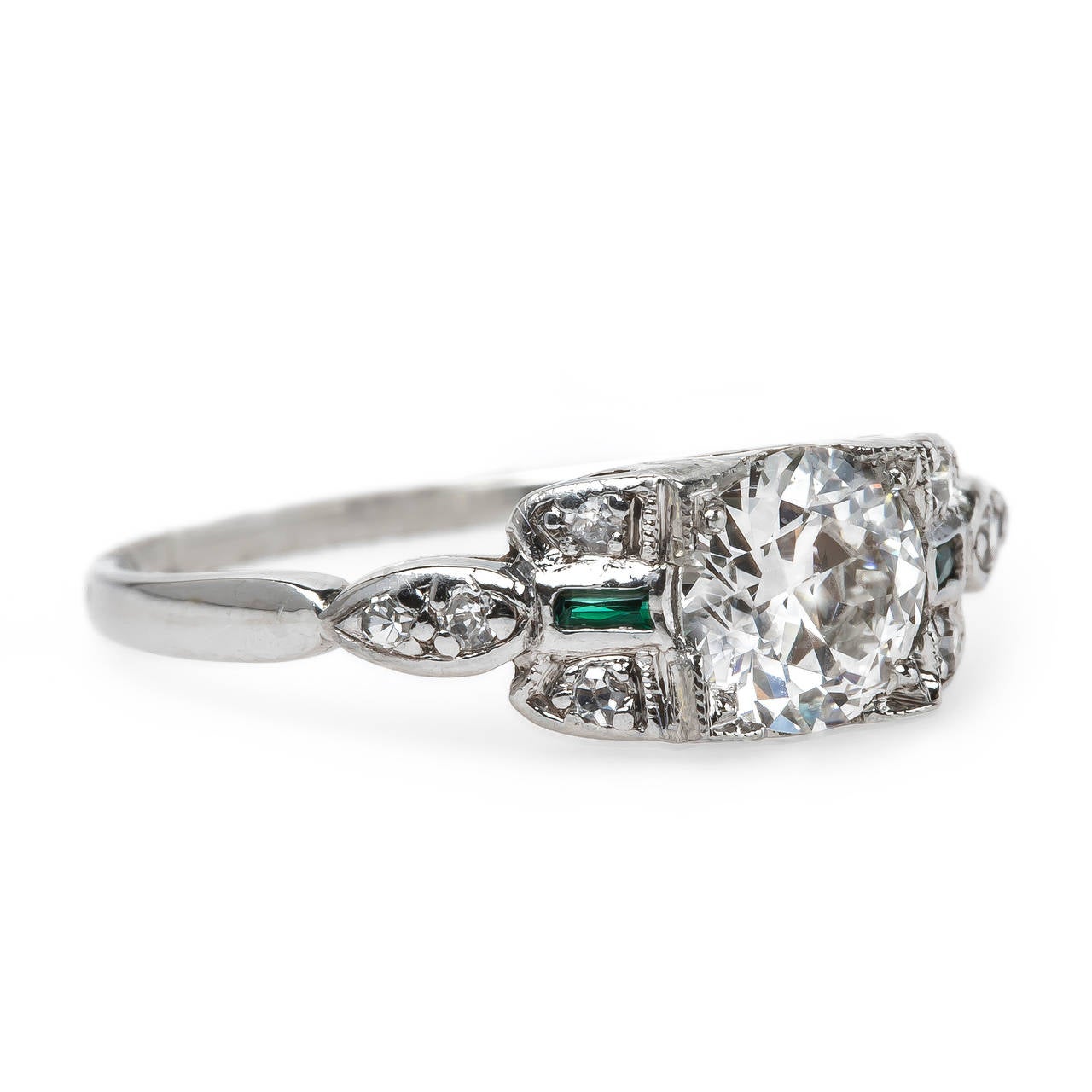 Sydney is a classic authentic Art Deco (circa 1920) platinum ring centering a shimmering box-set 0.70ct GIA certified Round Brilliant Cut diamond graded H color and VS2 clarity. This perfect engagement has a very low profile and is further designed