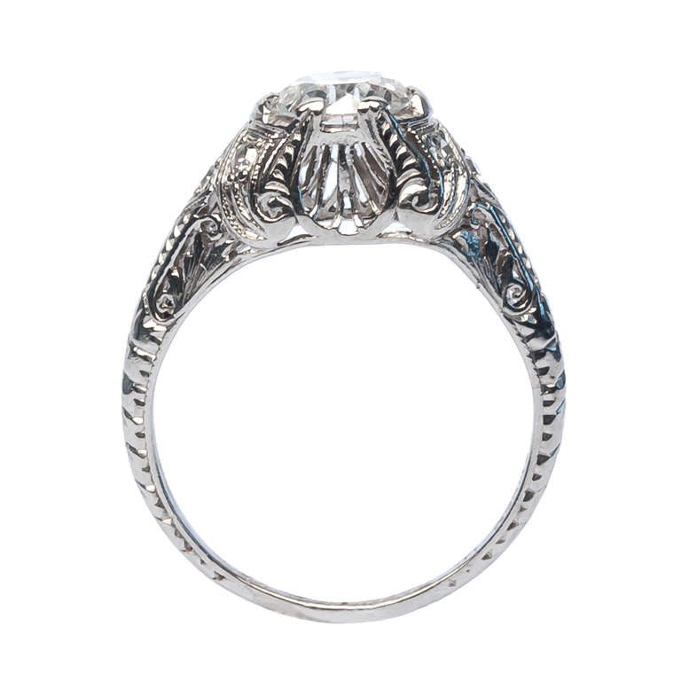 Chestnut Hill is an incredibly romantic vintage Edwardian Era engagement ring made from platinum featuring a 0.99ct EGL certified Old European Cut diamond graded D color and SI1 clarity. This unique and unusual engagement ring is enhanced with