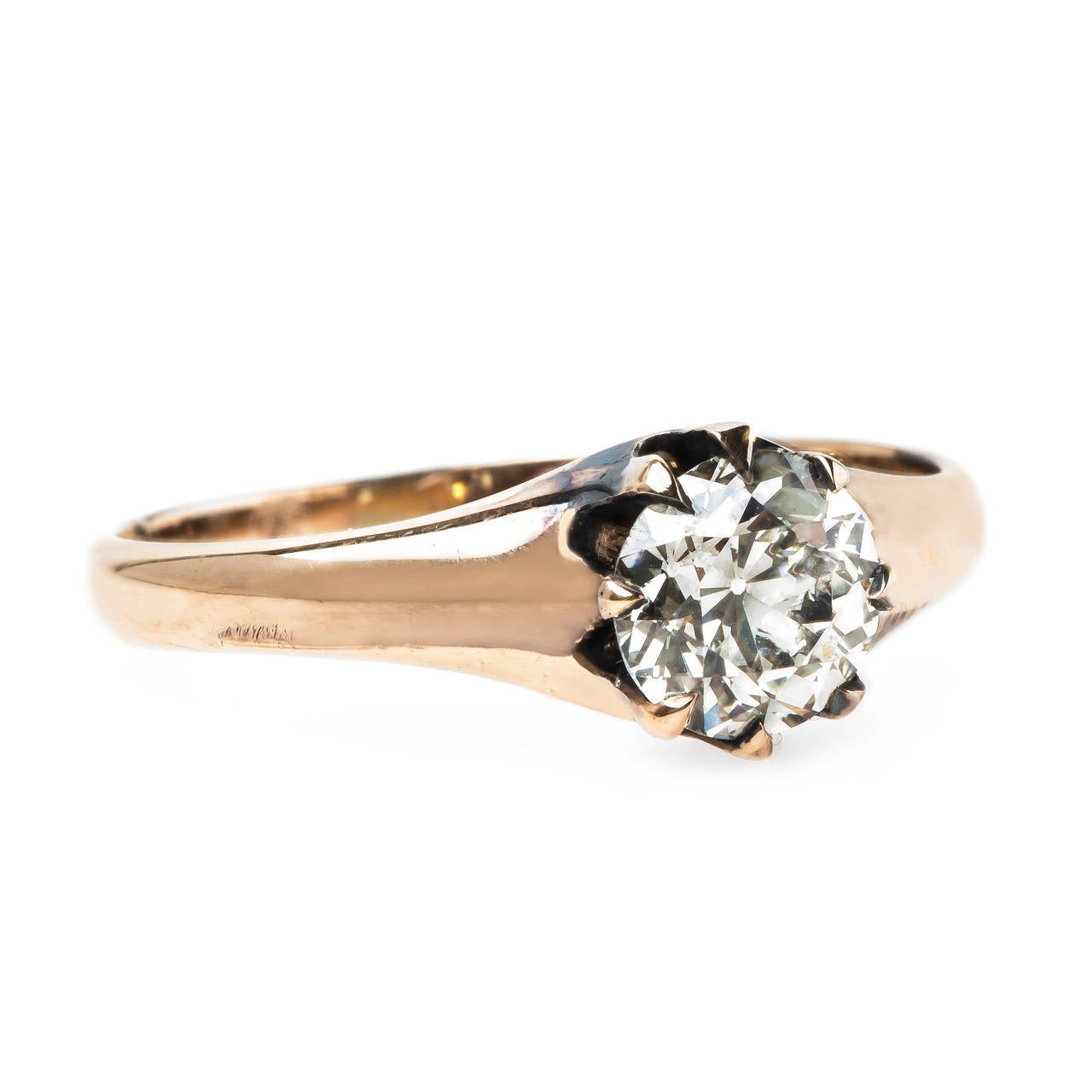 Eaglewood is a charming authentic Victorian era (circa 1890) diamond engagement ring made from 14k rose gold centering a 1.02ct EGL certified Old European Cut diamond graded L color and VS2 clarity. This gleaming solitaire diamond engagement ring