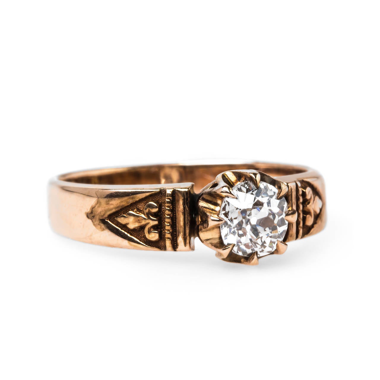 Braddock is an intriguing authentic Early Victorian era (circa 1860) 14k rose gold solitaire ring centering a eight-prong set 0.44ct EGL certified Old Mine Cut diamond graded H color and SI1 clarity. The stunning and unique antique ring is finished