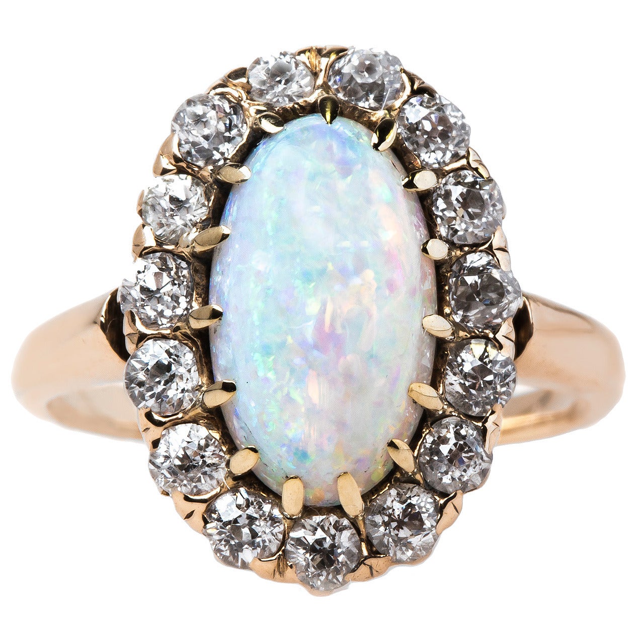 Alluring Victorian Era Oval Opal Engagement Ring with Diamond Halo