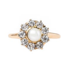 Delicate and Feminine Victorian Era Pearl Ring with Diamond Halo