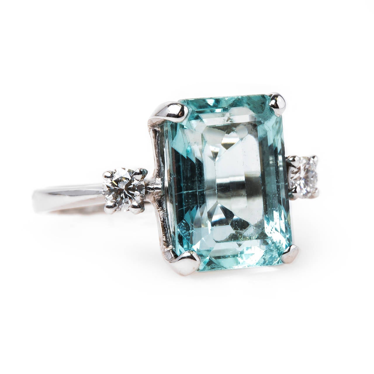 Whitsett is the epitome of Retro era (circa 1940) cocktail ring design. This fabulous ring centers a show-stopping Rectangular Step-Cut natural aquamarine set in 14k white gold and gauged at approximate 4.50ct (11.9mm x 8.8mm). The ring is further