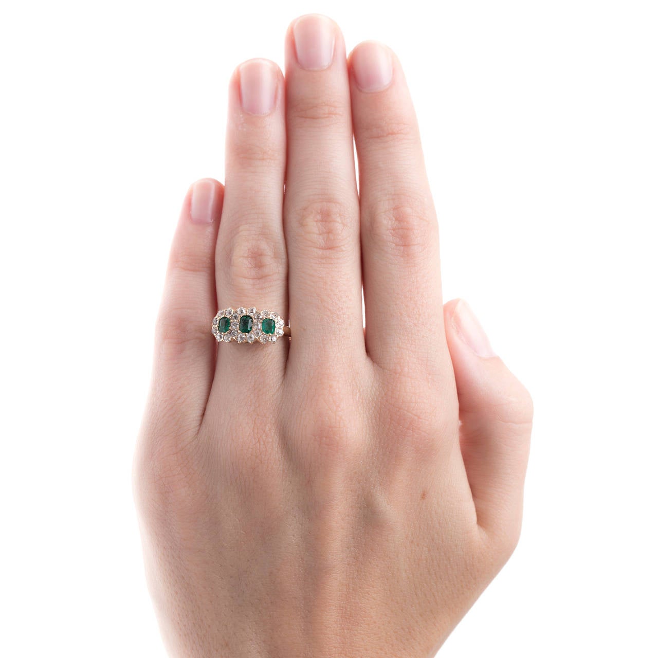 Late Victorian Three Stone Emerald Ring with Diamond Halo In Excellent Condition In Los Angeles, CA