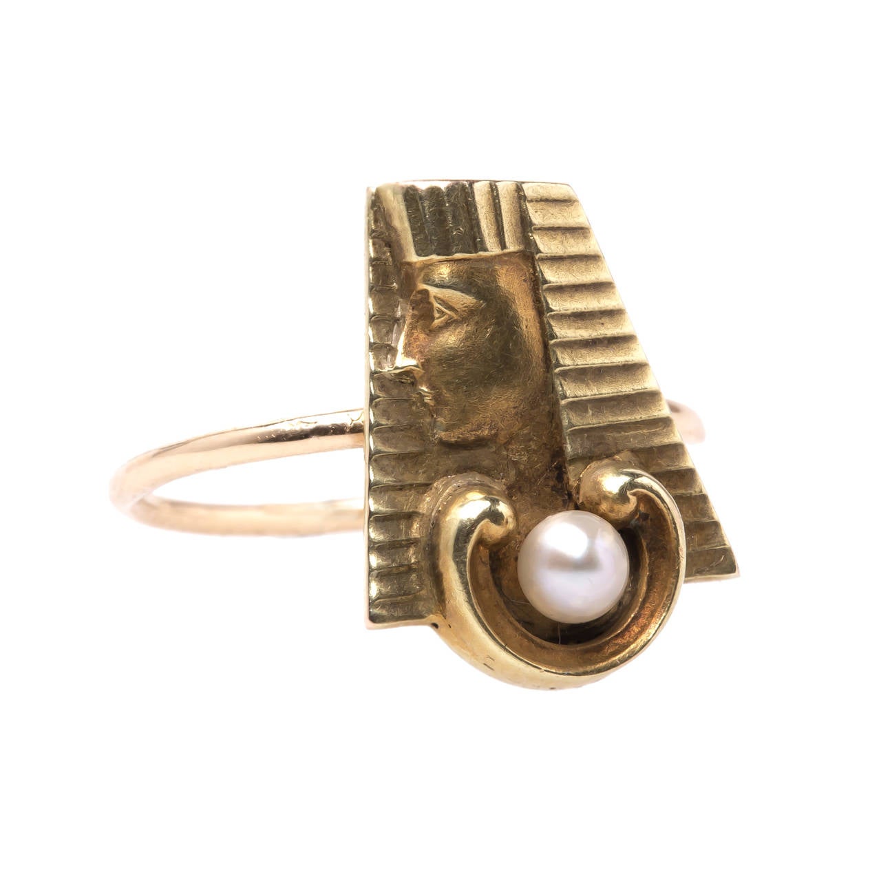 Cairo is a unique Victorian era ring converted from a 14k yellow gold stick pin depicting the profile of an Egyptian pharaoh accented with a single cultured pearl gauged at 3mm. Cairo is a size 6 and can be sized to fit.