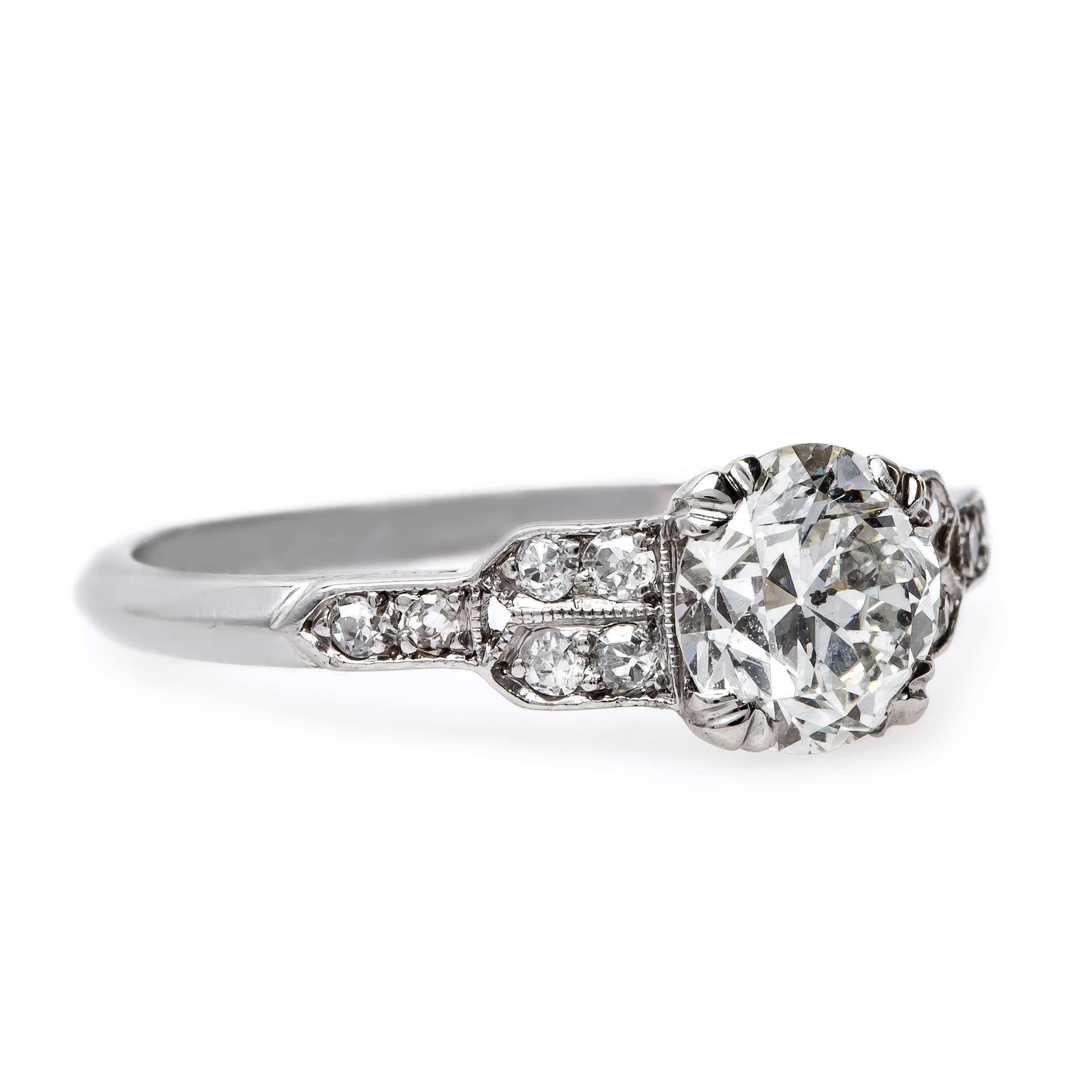 Queen Street is a truly one-of-a-kind Art Deco (circa 1930) platinum engagement ring with an elaborate prong-set 1.20ct EGL certified Old European Cut diamond graded G color and SI2 clarity. This sparking center diamond set low to the finger framed