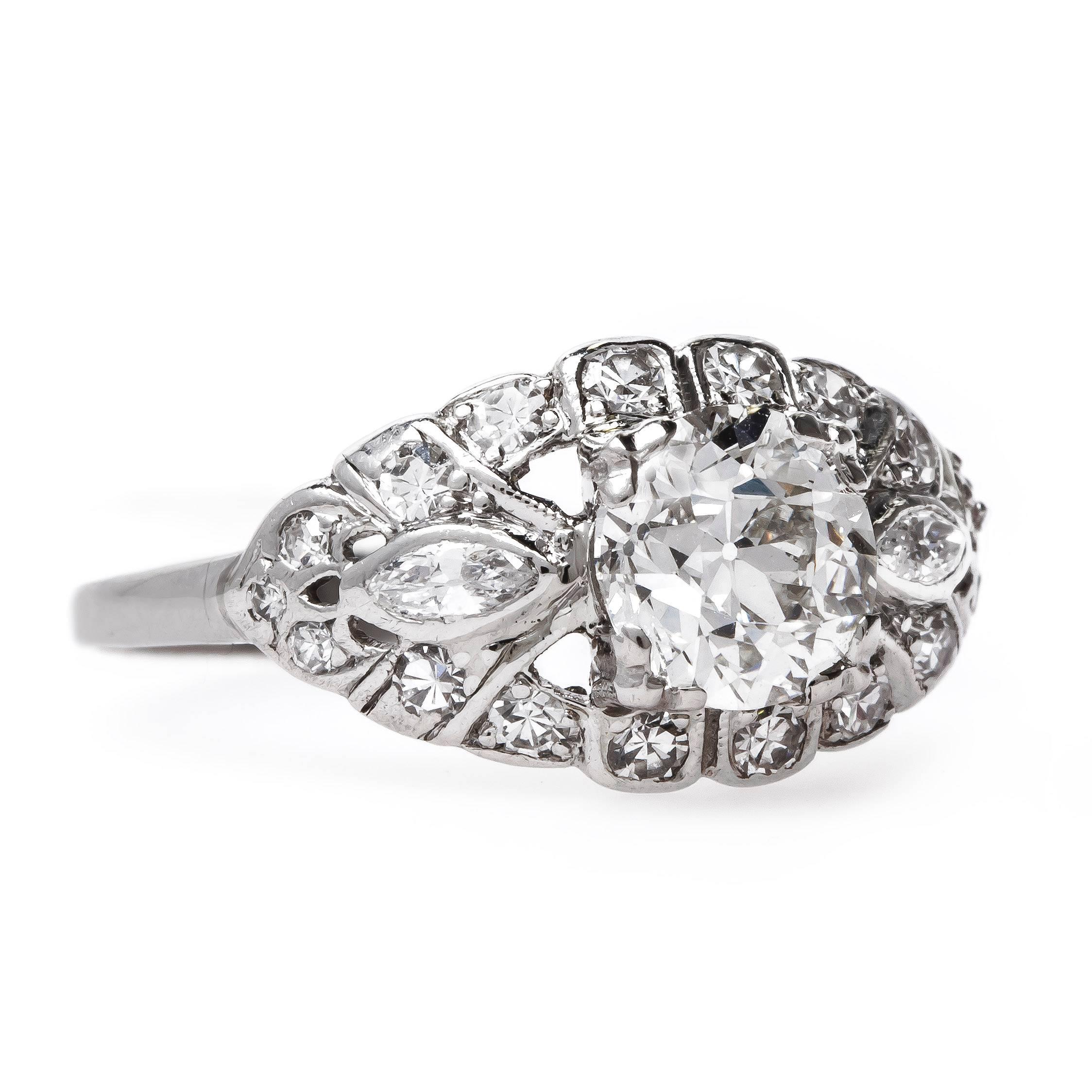 Kingsway is a stunning one-of-a-kind vintage engagement ring reflecting true Art Deco (circa 1930) design! The gorgeous platinum ring centers a 1.11ct EGL certified Old European Cut diamond graded I color and VS1 clarity. The glimmering main diamond