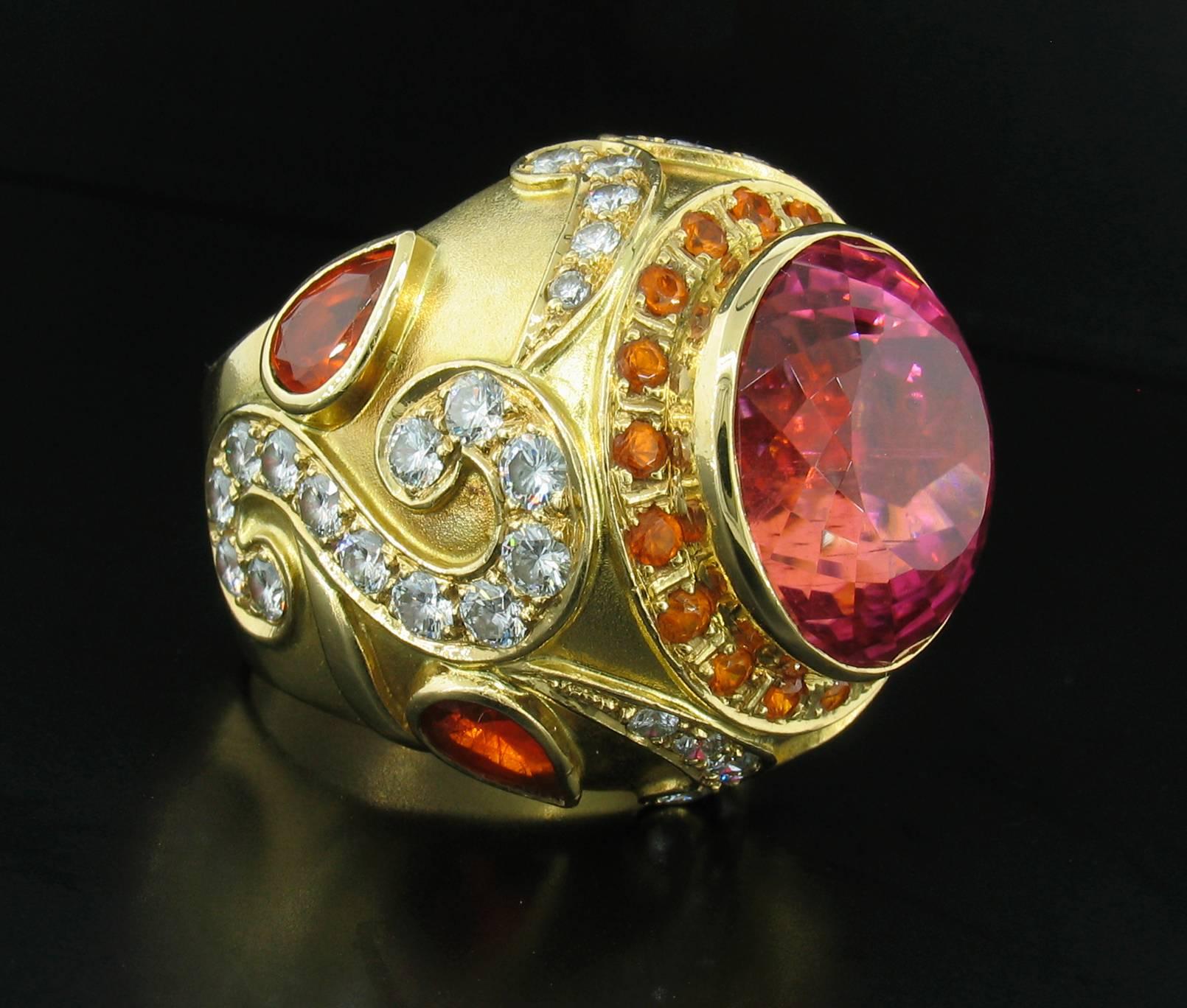 California Tourmaline, Garnet and Diamond Ring; This ring was designed and made by well known designer Paula Crevoshay.  It features an incredible, rare California Pink Tourmaline weighing 25.61 carats, Garnets weighting 3.60carats and Diamonds