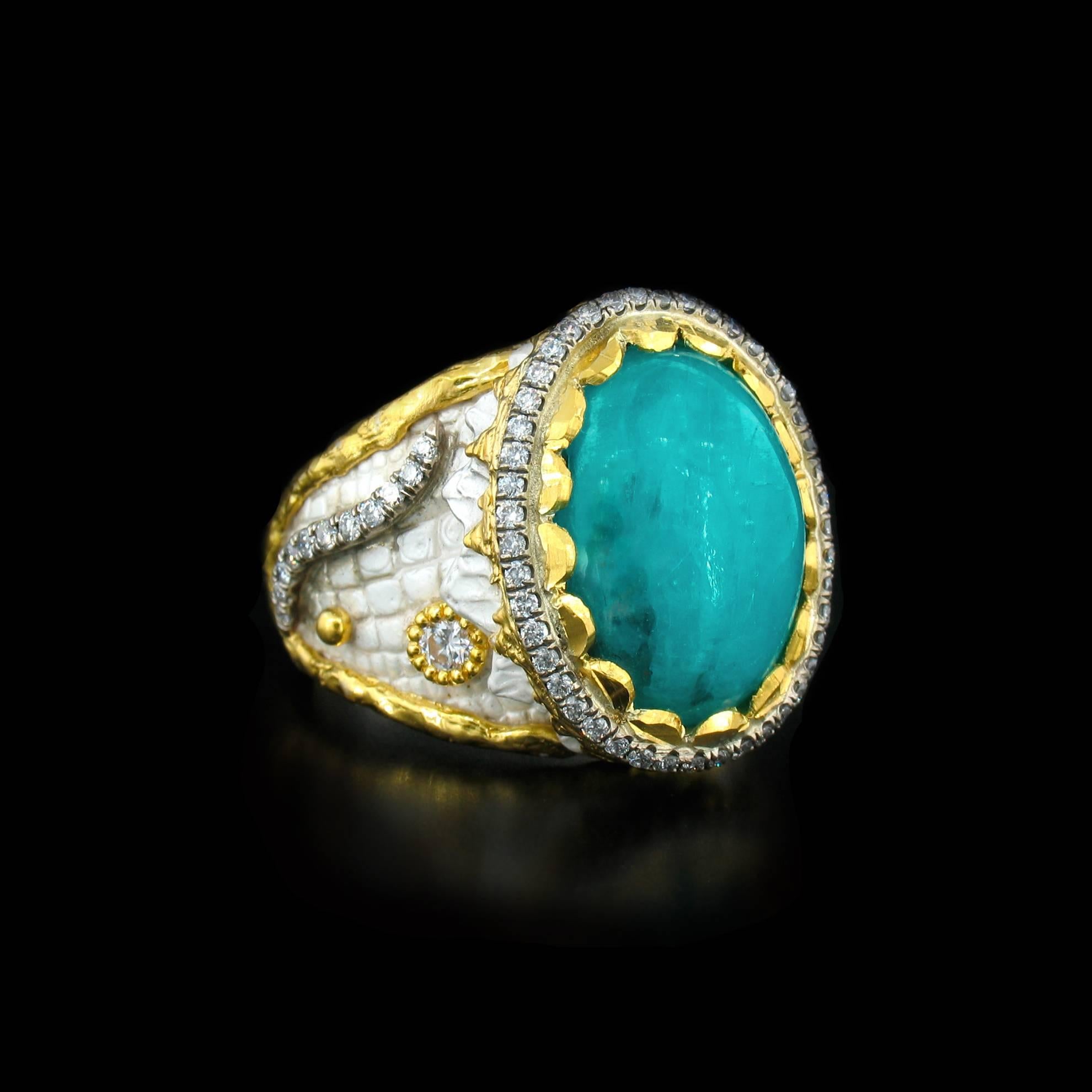 This exquisite Paraiba and Diamond Ring features a 7.36 carat Brazilian Paraiba, accented with 0.60 carats of fully faceted Diamonds.  They are set in a combination of 24K Gold, 18K Gold and Silver. To give this ring a beautiful unique look, the