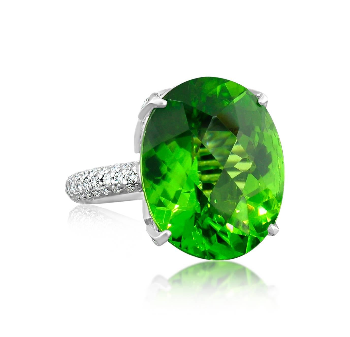 Burmese Peridot is the most desirable of it's kind in the world.  This outstanding example weighs 16.42 carats.  It is set in a gorgeous platinum setting pave set with 1.50 carats in Diamonds.  Size 7 1/2.
**This ring may be resized to fit after