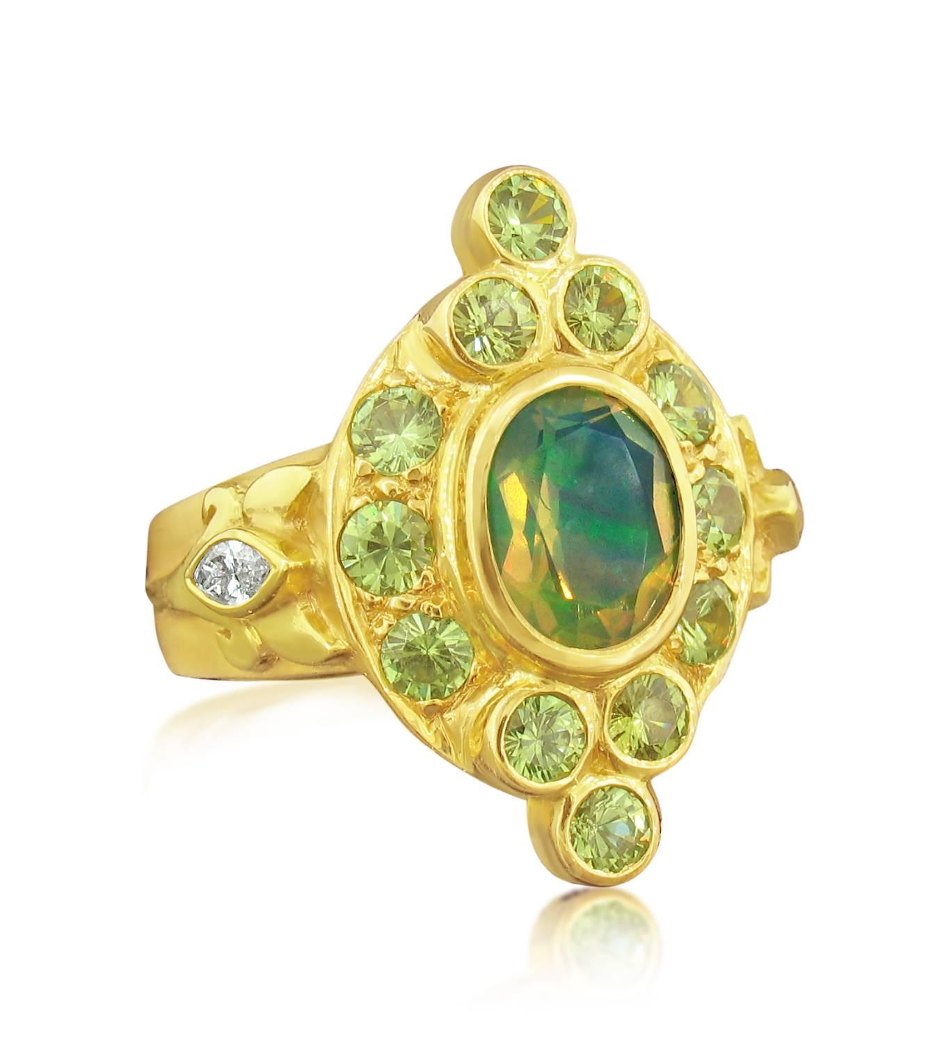 This ring was designed and made by well known designer Paula Crevoshay. It contains a very unique, beautifully colored Mexican Opal weighing 1.29 carats.  It is surrounded by 12 rare Demantoid Garnets weighing 1.70 carats  These are the rarest of