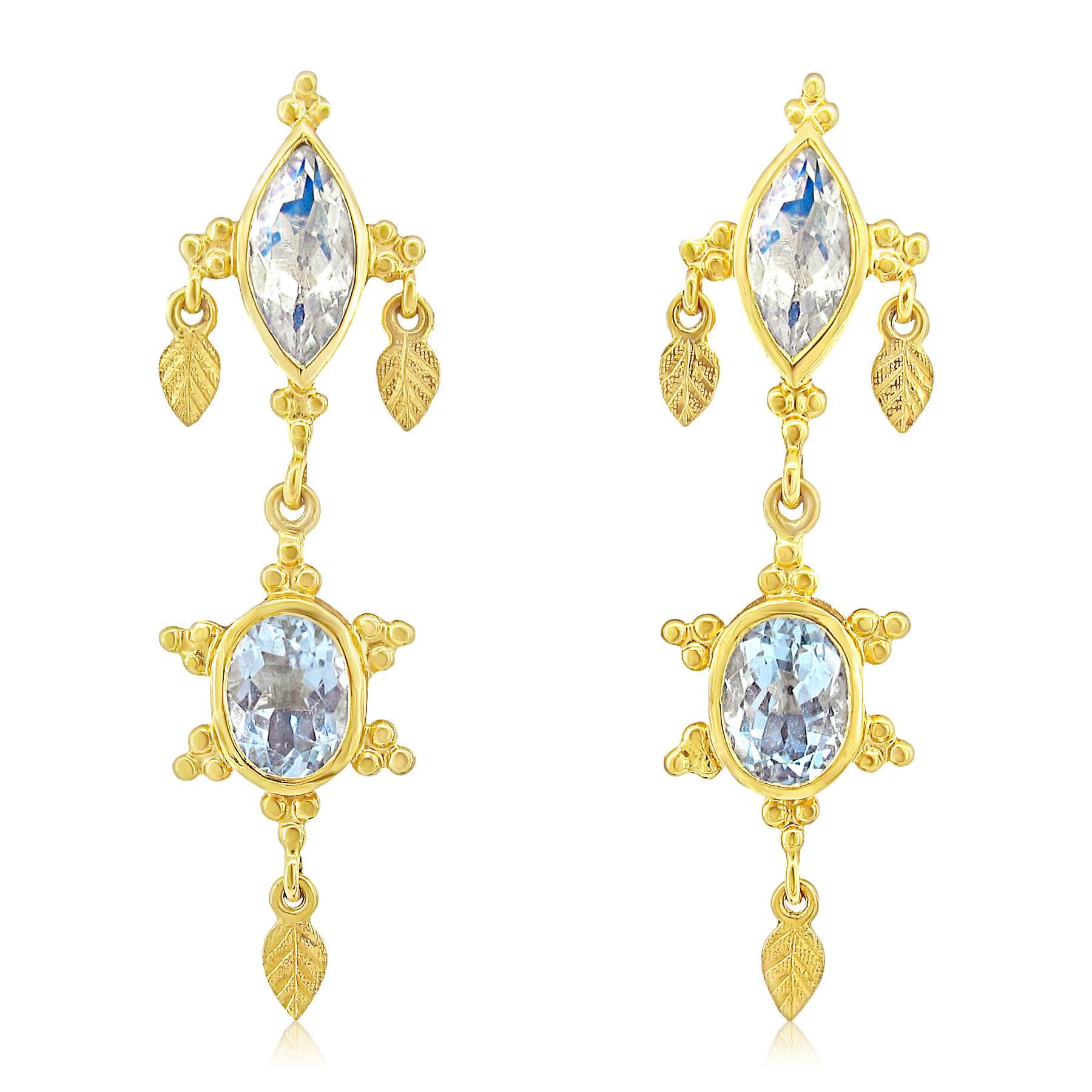 These earrings were designed and made by well known designer Paula Crevoshay. They contain two beautiful Oval Aquamarines weighing a total of 2.26 carats.  The tops feature two marquis shaped Moonstones weighing a total of 1.87 carats.  There are