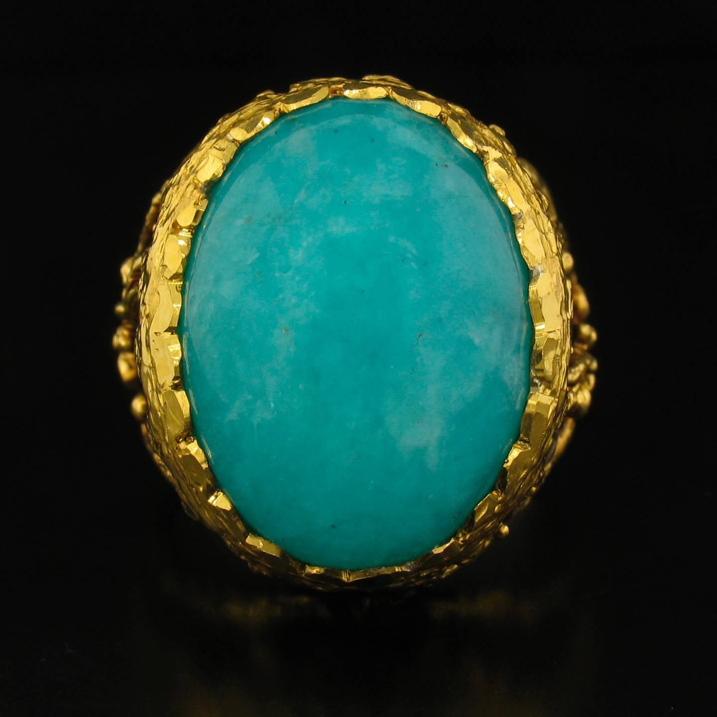 This ring was designed and made by well known designer Victor Velyan.  It contains beautiful turquoise-blue colored cabochon of Amazonite weighing 16.38 carats, and Diamond accents weighing 0.11 carats.  It is made of a base of pure Silver with all