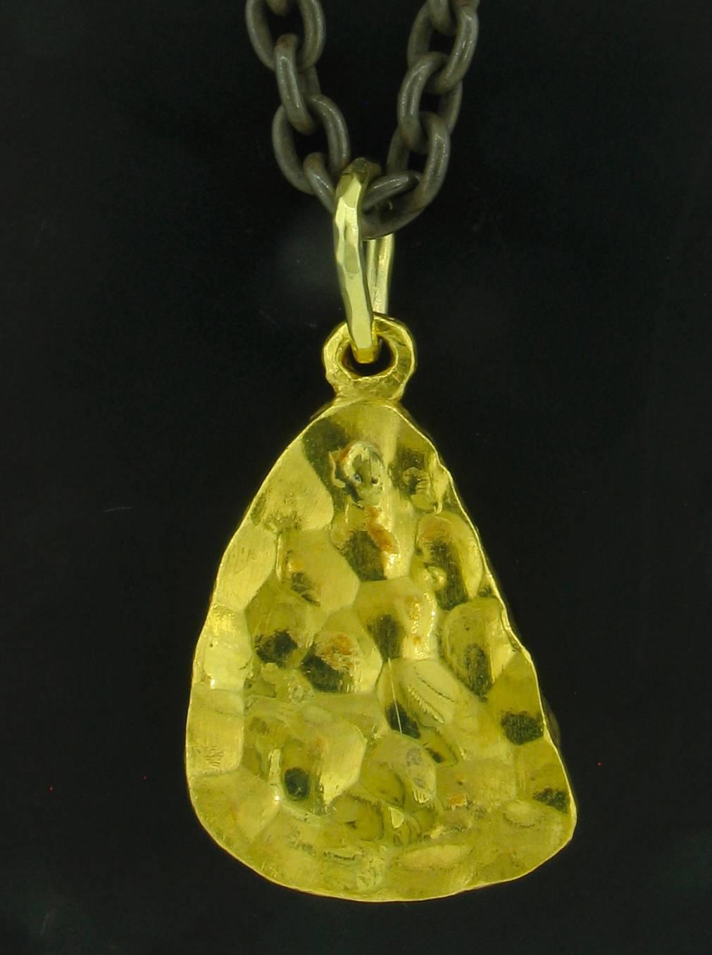 This is a beautiful Boulder Opal pendant designed and made by well known designer Victor Velyan.  Photos do not do the opal justice - It's hard to photograph without getting reflections.  it has very intense color and beautiful feathering.  The opal