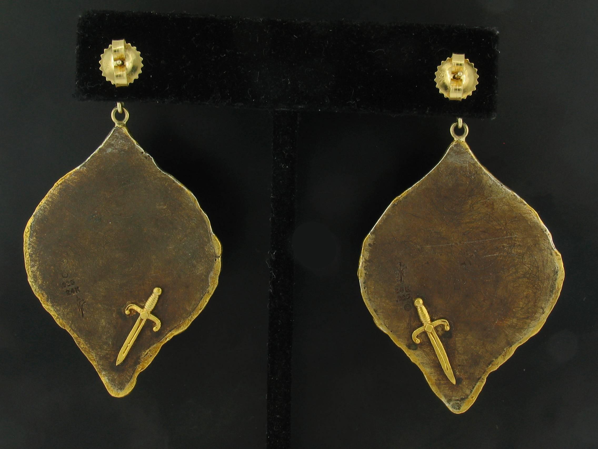 These Earrings were designed and made by well known designer Victor Velyan.   They contain all Rosecut Diamonds weighing a total of 0.51 carats.  They are made of a base of pure Silver with all accent work created in 24k yellow Gold.  The 'brown' is
