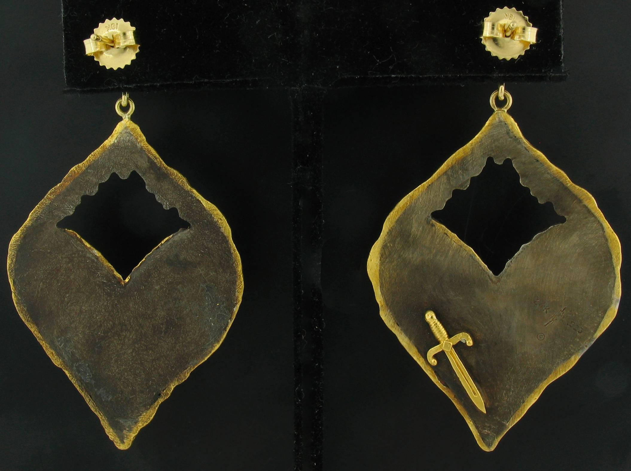 These Earrings were designed and made by well known designer Victor Velyan.   They contain Diamonds weighing a total of 0.53 carats.  They are made of a base of pure Silver with all accent work created in 24k yellow Gold.  The 'brown' is a