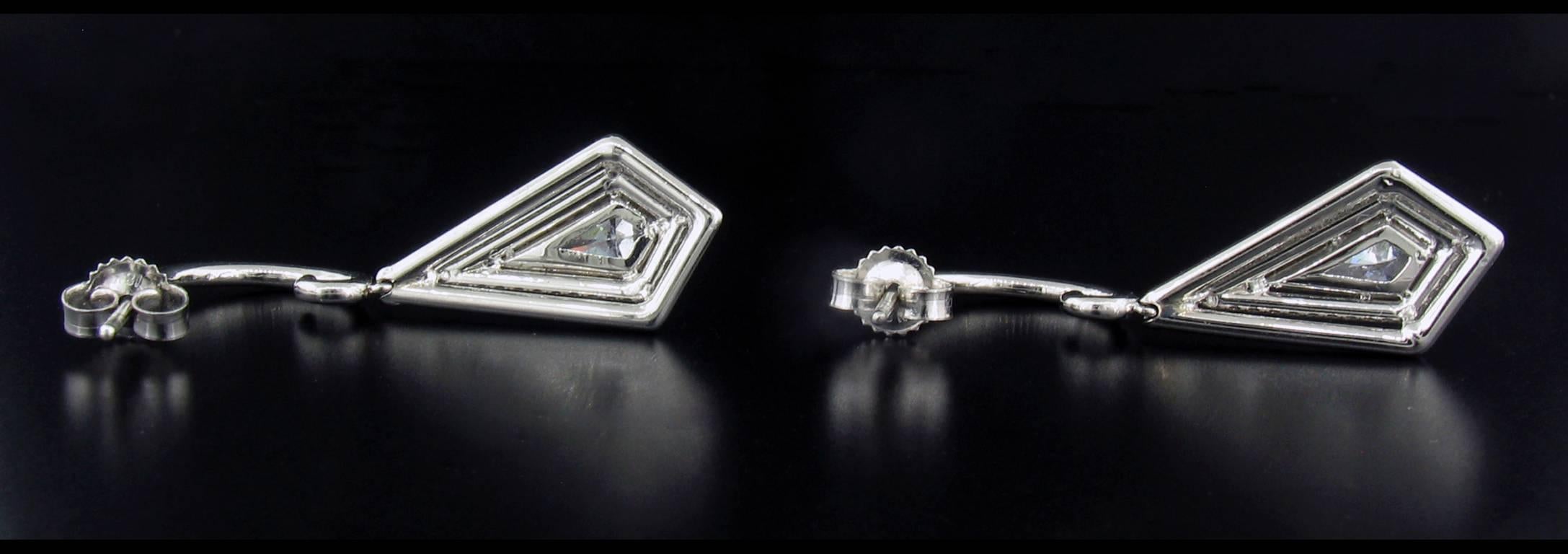 Kite shaped diamonds are unusual to find, especially in earrings! These were made by Michael Barin, Los Angeles.  These are set in platinum with diamond weight totaling 1.66 carats.  (Kites weigh 0.42 carats total, Pave weighs 1.24 carats total.)