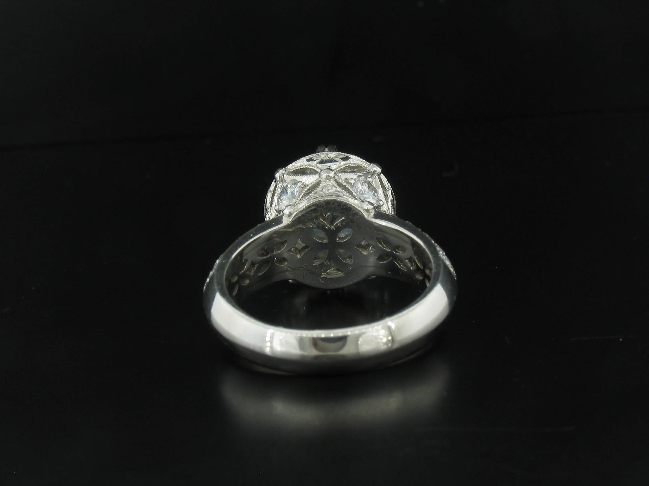 Gorgeous Platinum Semi Mount Ring by Varna.  Diamonds in the setting weigh a total of 1.05 carats.  The center stone is a synthethic Cubic Zirconia meant as a placeholder so you can choose your own stone in the 9-9 1/2mm diameter range.  Size 6 1/2