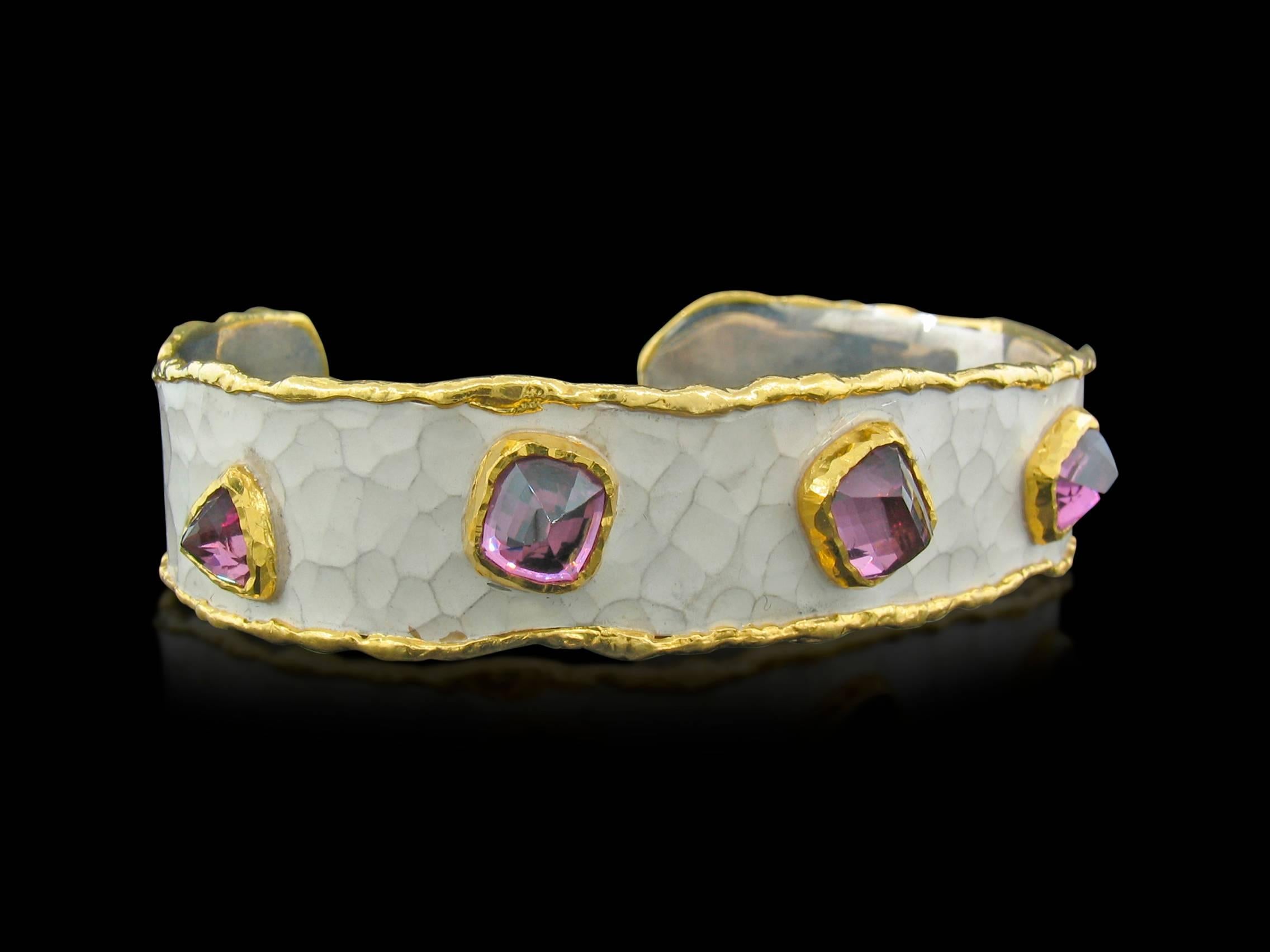 This is a fabulous Cuff designed and made by well known designer Victor Velyan who makes the most comfortable cuffs in the industry.  They can be custom fitted to your wrist.  This one contains 5 Raspberry colored Garnets weighing a total of 7.62