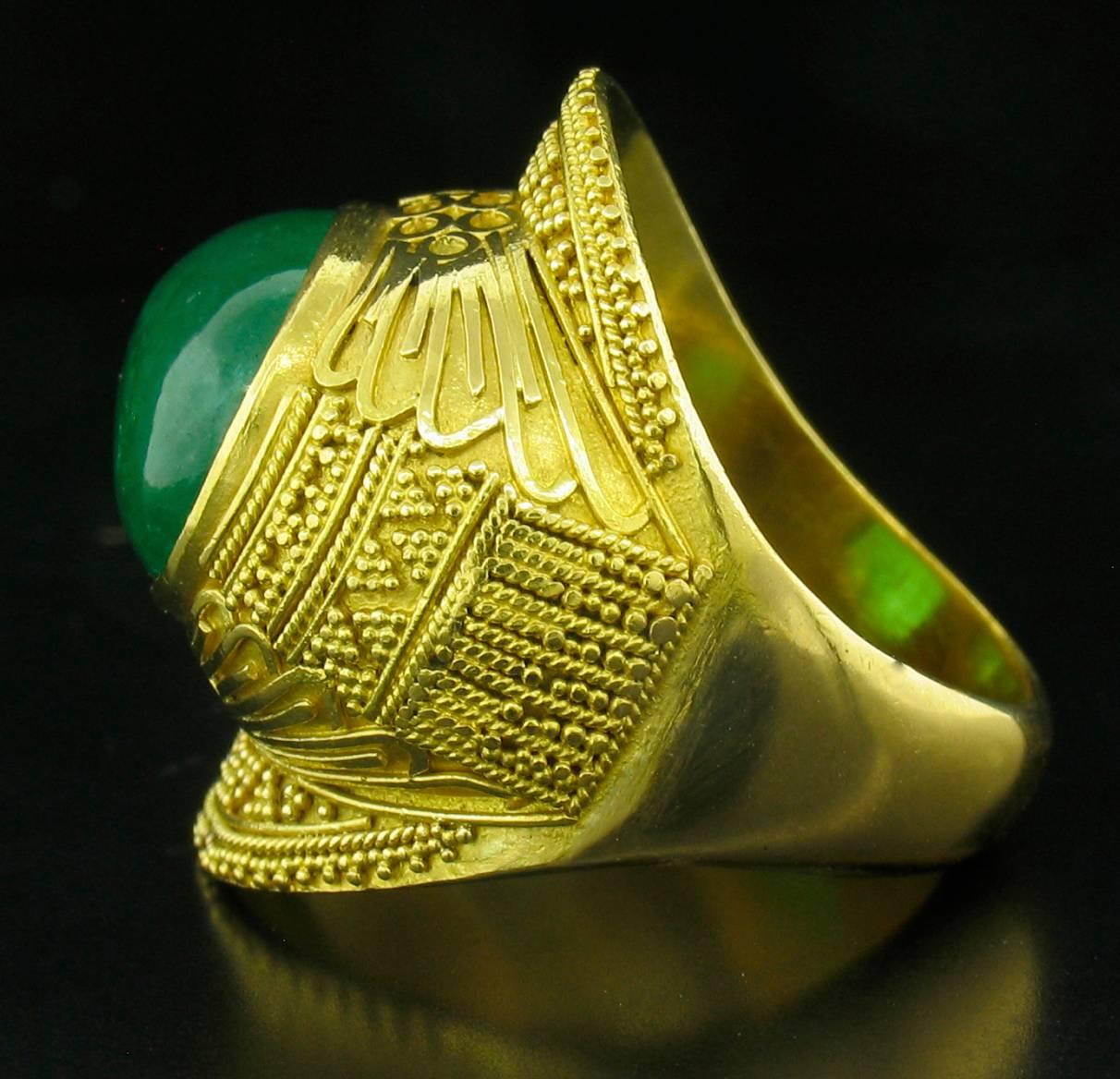 'Emerald 'Ramses' ring in 22k Yellow Gold; Designed by Carolyn Tyler.  Features an 8.95ct cabochon Emerald with hand granulation details framing the stone.  This is Carolyn's most popular design, a very flattering and interesting ring.  Size:  27mml