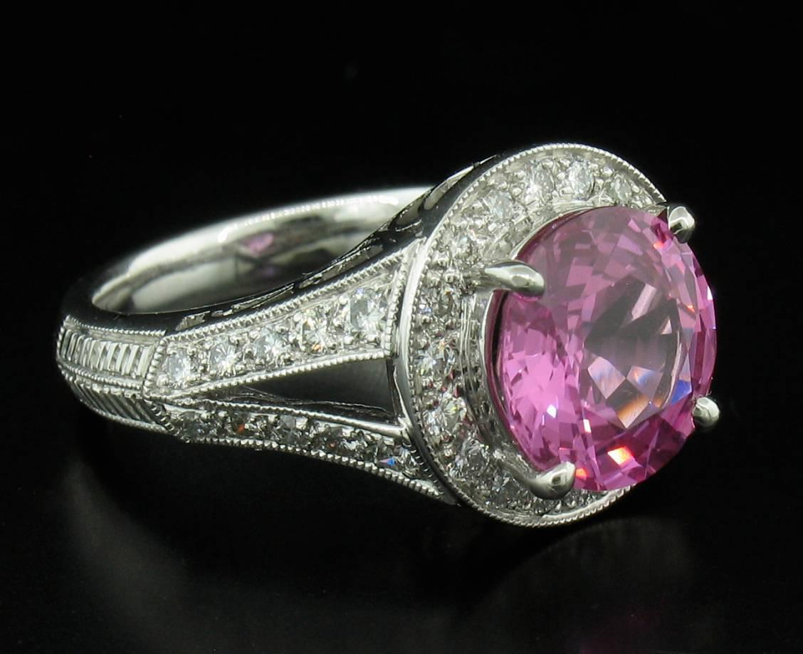 This stunning pink sapphire weights 3.53 carats and is accented by fully faceted diamonds weighing a total of 0.55 carats in a platinum setting.  Size 4 1/2.
**This ring may be resized to fit after purchase at no cost to the buyer.
