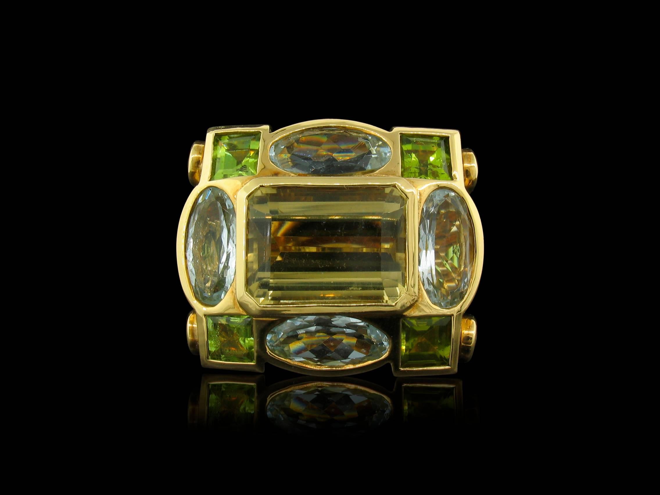 Tony Duquette Citrine, Aquamarine and Peridot Ring in 18K Gold. This amazing jewel has a total weight of 17 carats of Citrine, 11 carats of Aquamarine, and 8 carats of Peridot. Size 6 3/4, fits a size 7 1/4.

Tony Duquette was a well-known painter,