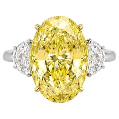 GIA Certified 7 Ct. Fancy Yellow Oval Cut Diamond Platinum Ring