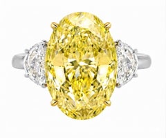 GIA Certified 7 Ct. Fancy Yellow Oval Cut Diamond Platinum Ring