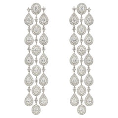 Boucles d'oreilles chandelier poire naturelle 18 carats et diamants ovales en grappe