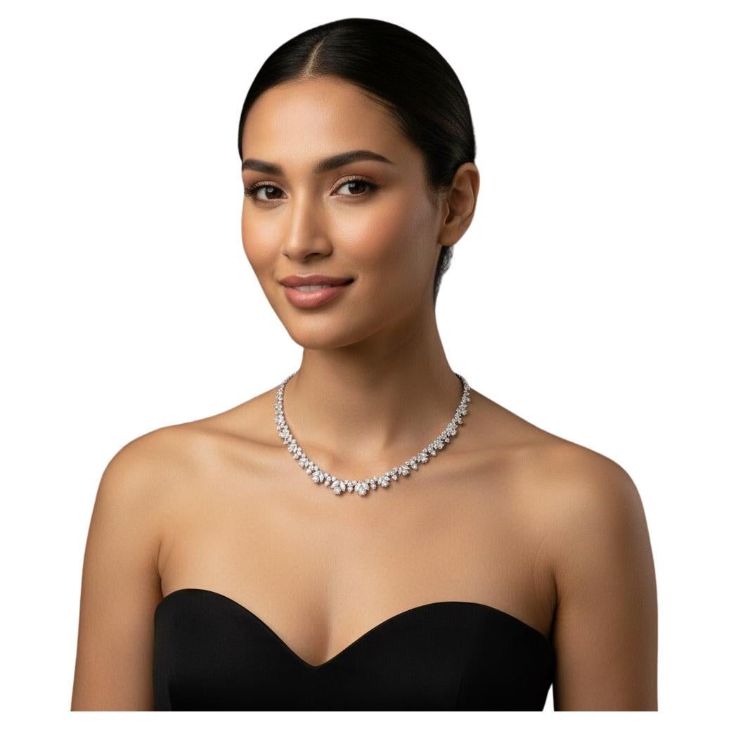 A magnificent high-jewelry creation, this 18K White Gold Graduated Flower Necklace is composed of an exceptional arrangement of marquise and round brilliant diamonds, meticulously set to form an elegant graduated floral pattern. The craftsmanship,