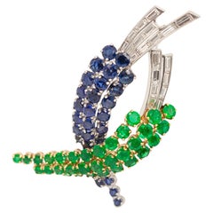 Broche en platine et or jaune 18 carats, saphir, émeraude et diamant