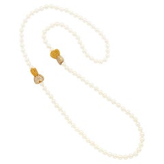 Collana "Filo di perle" di Van Cleef & Arpels con doppio cuore in zaffiro giallo e diamanti