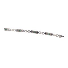 Bracelet à maillons géométriques en or blanc, saphir, émeraude et diamant