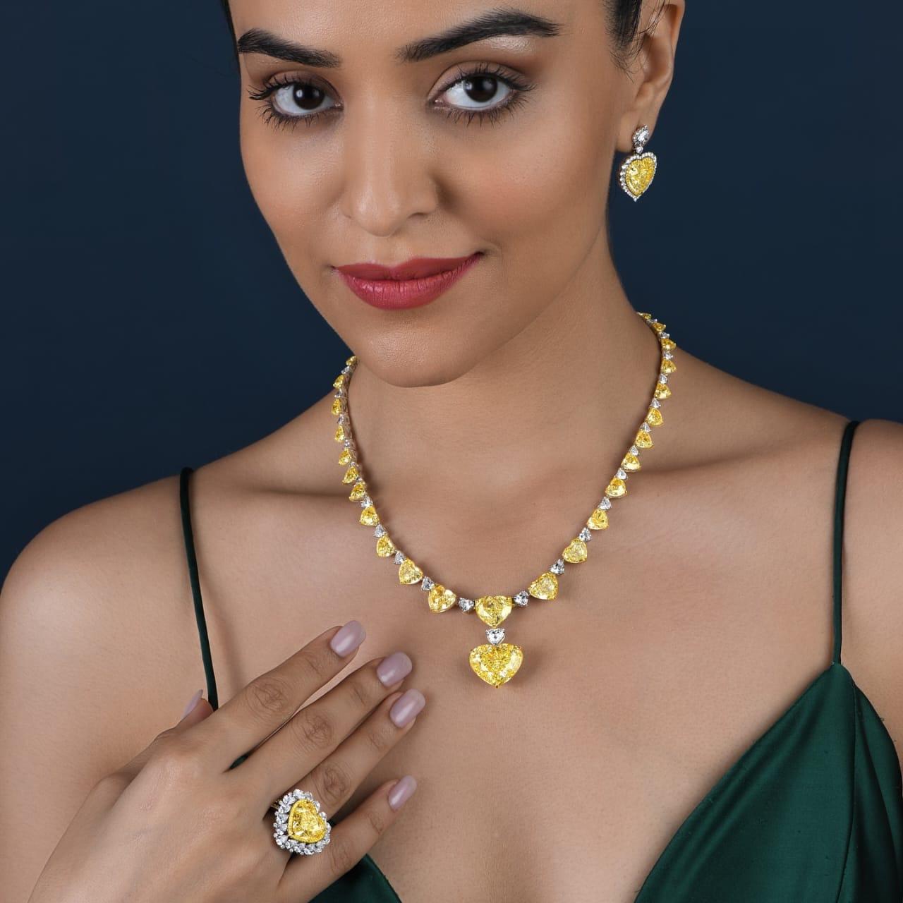 Modern LEGACY GIA 70 Carat Fancy Intense Yellow heart diamond necklace 10 Carat Center For Sale